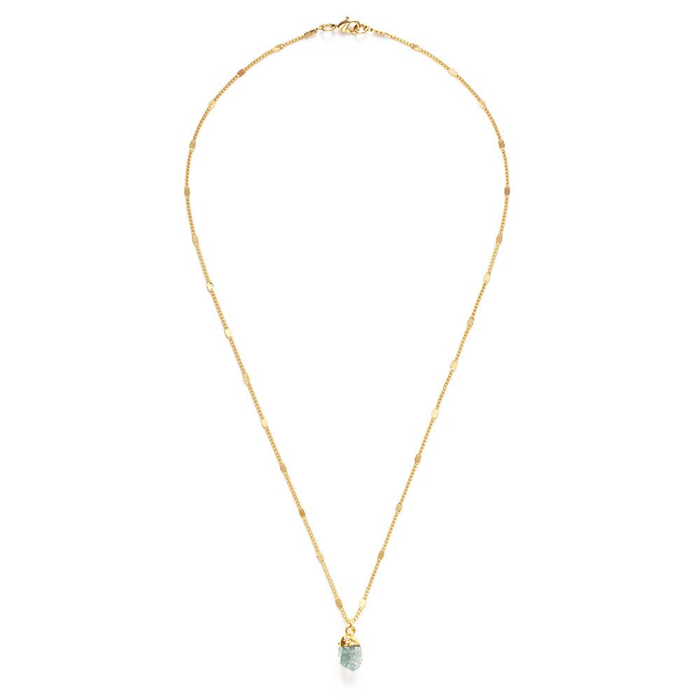 Gold necklace with a green pendant on a white background