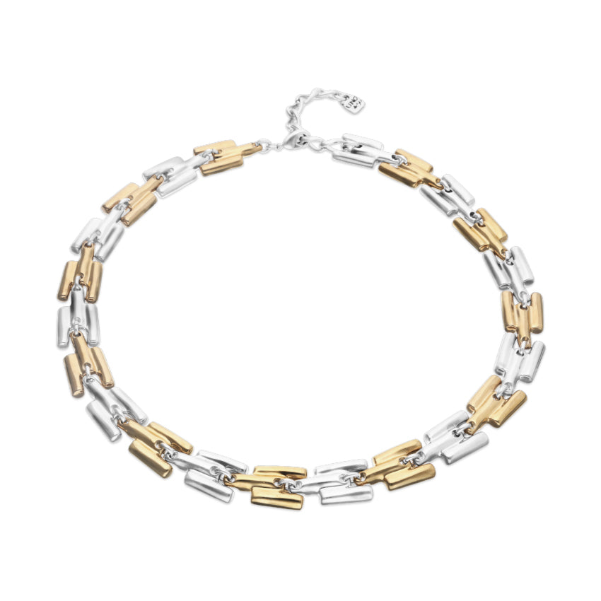 Two-tone gold and silver necklace on a white background