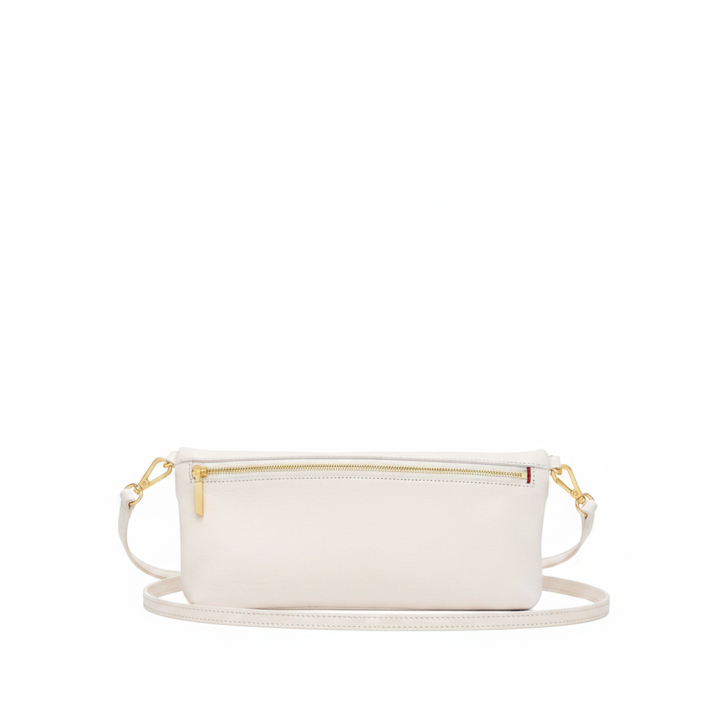 An off-white leather pouch with a gold zipper and a tiny red accent tab, shown against a plain white background.