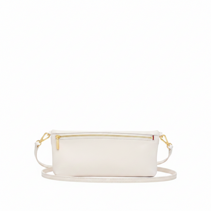 An off-white leather pouch with a gold zipper and a tiny red accent tab, shown against a plain white background.