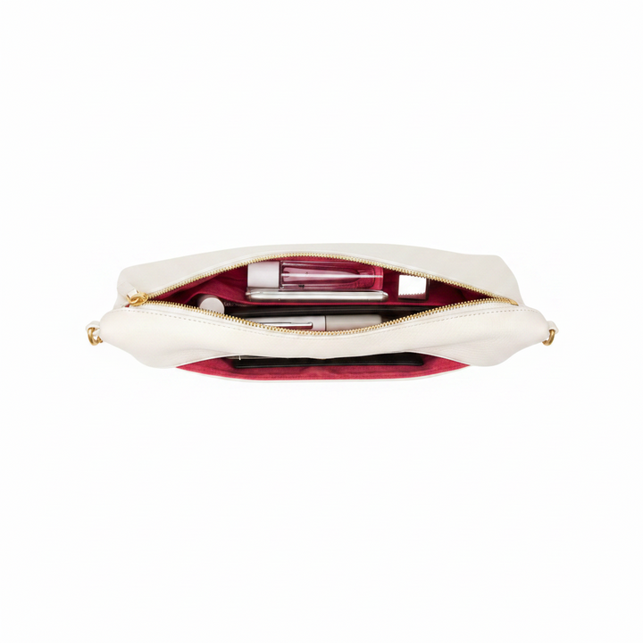 White clutch bag with gold zipper on a white background