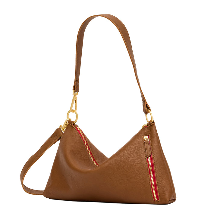 A brown pebbled leather shoulder bag with gold-tone hardware and a red zipper accent, shown on a clean off-white background.