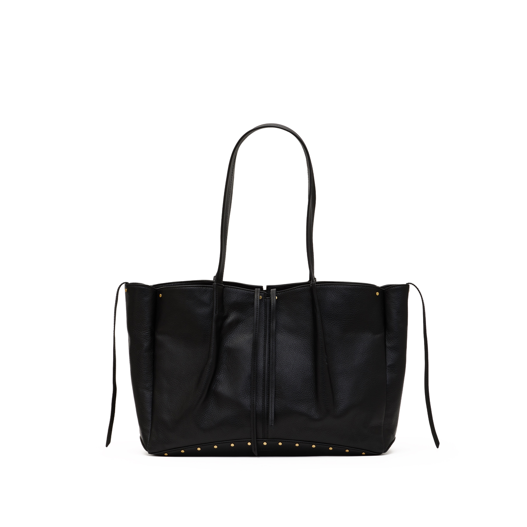 A black leather tote bag with double shoulder straps, a front zipper closure, and gold-tone studs along the bottom edge, shown against a plain white background.