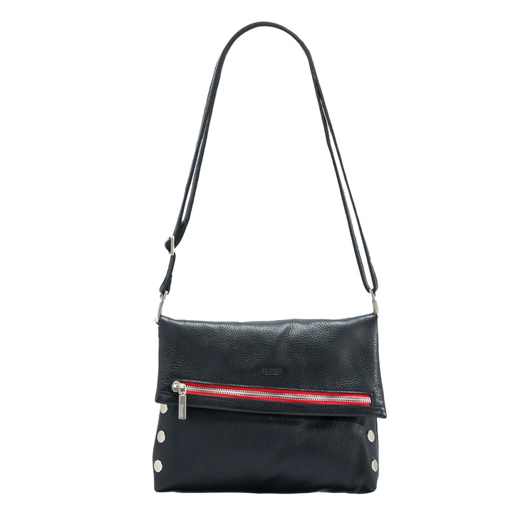 Black pebbled leather crossbody bag with a front zip pocket featuring a red and white striped leather accent, silver-tone hardware, and a long shoulder strap, shown on a plain white background.