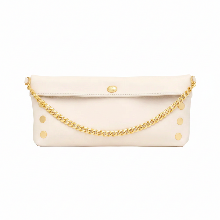 White clutch bag with gold chain strap on a white background