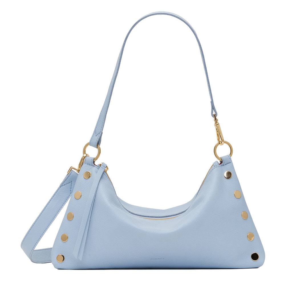 A light blue leather shoulder bag with gold-tone hardware, including gold studs, rings, and a clasp, shown on a plain white background.