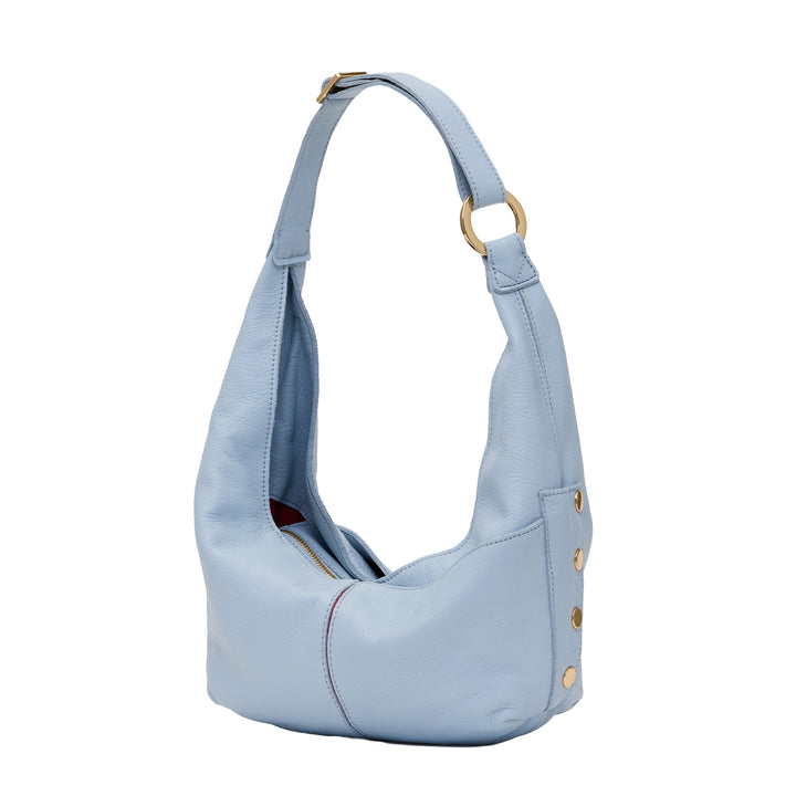 A light blue pebbled leather hobo shoulder bag with gold-tone hardware, including a ring on the strap and decorative studs on the side, shown against a plain white background.