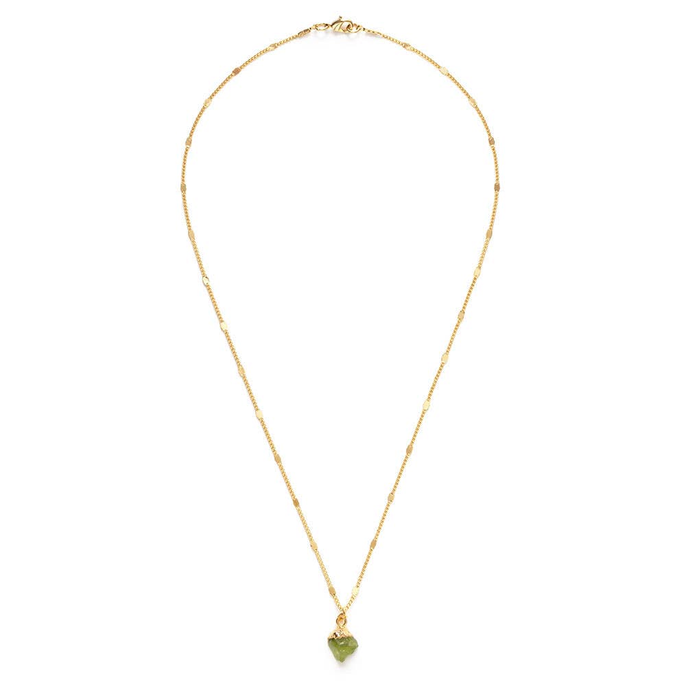Gold necklace with a green heart pendant on a white background