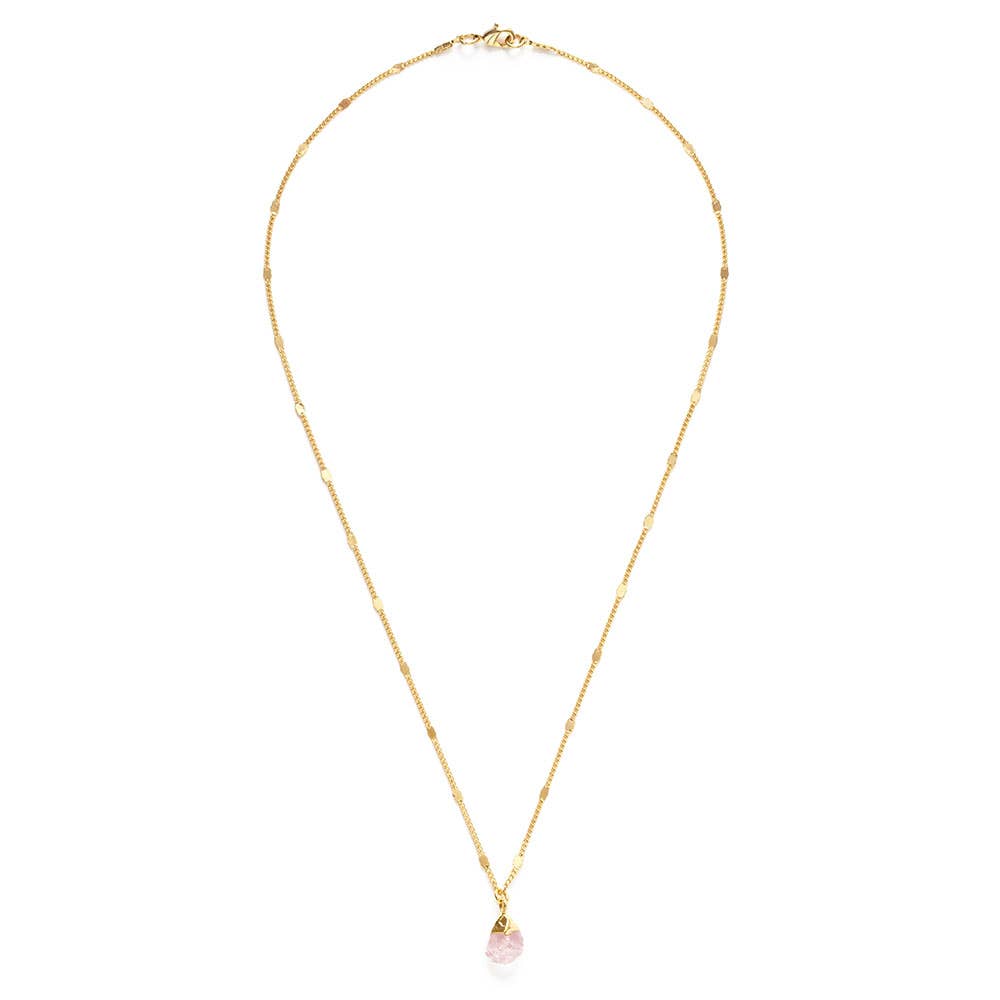 Gold necklace with a pink pendant on a white background