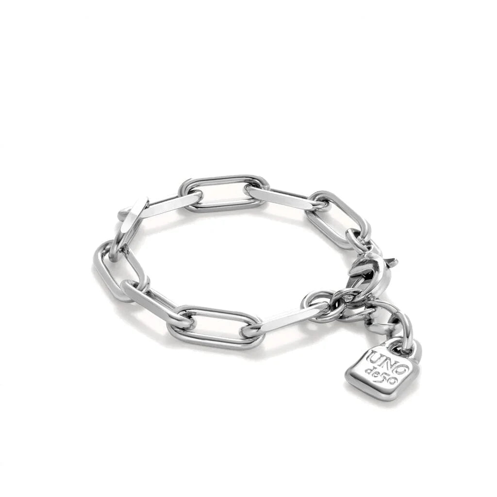 Silver chain bracelet with a heart-shaped tag on a white background