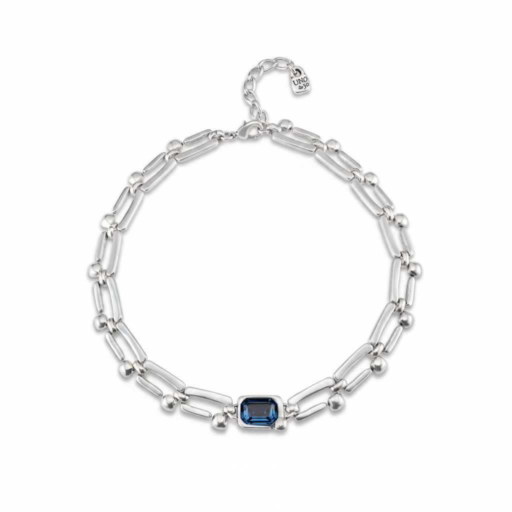 Silver bracelet with a blue gemstone on a white background